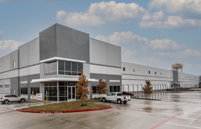 modern office space attached to warehouse in spacious parking lot